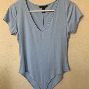 Blue v-neck body suit.